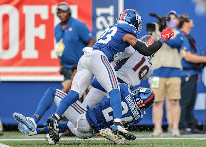 Denver Broncos receiver Jerry Jeudy (10) is tackled by cornerback James Bradberry (24). Mandatory Credit: Vincent Carchietta-USA TODAY